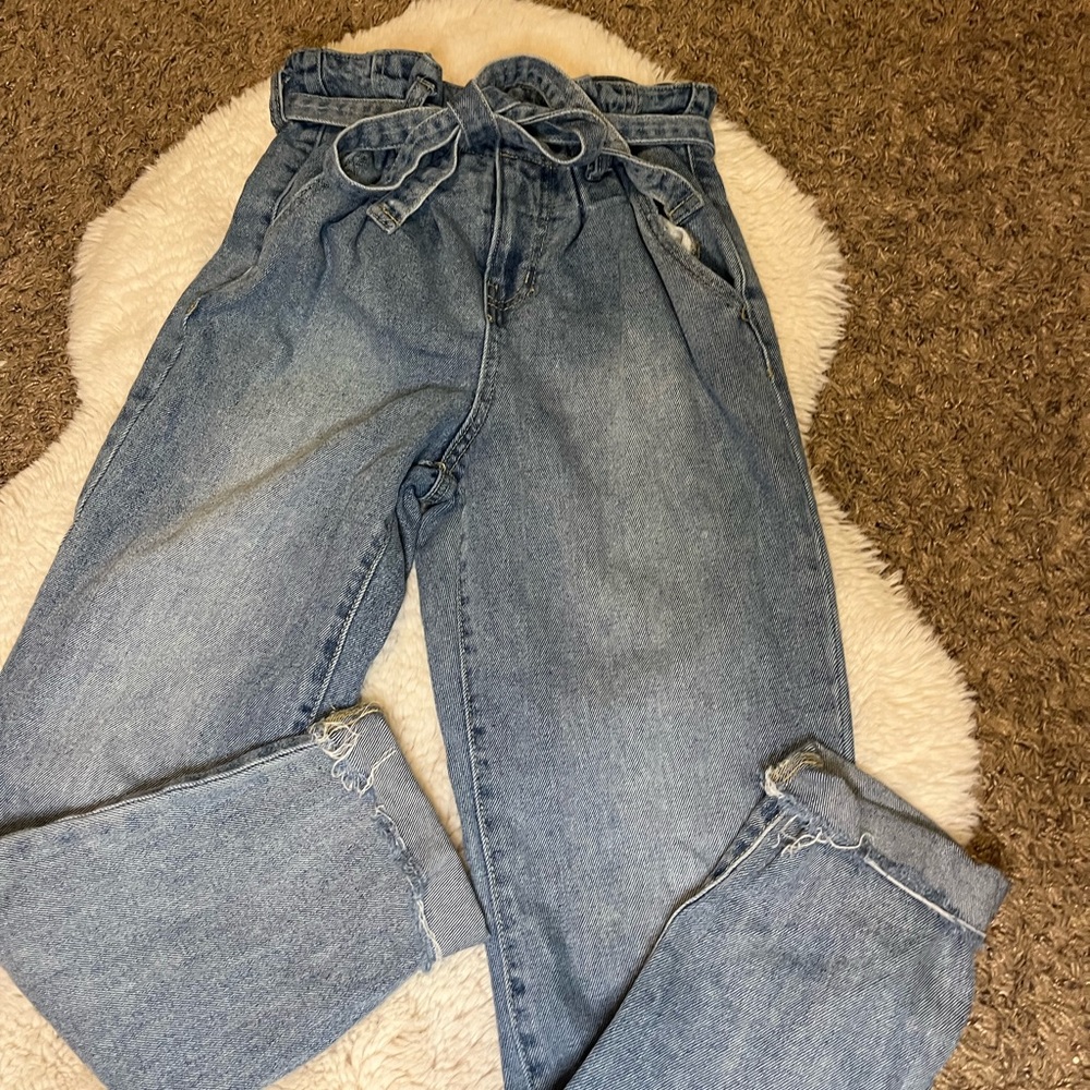 light wash blue bow tie jeans